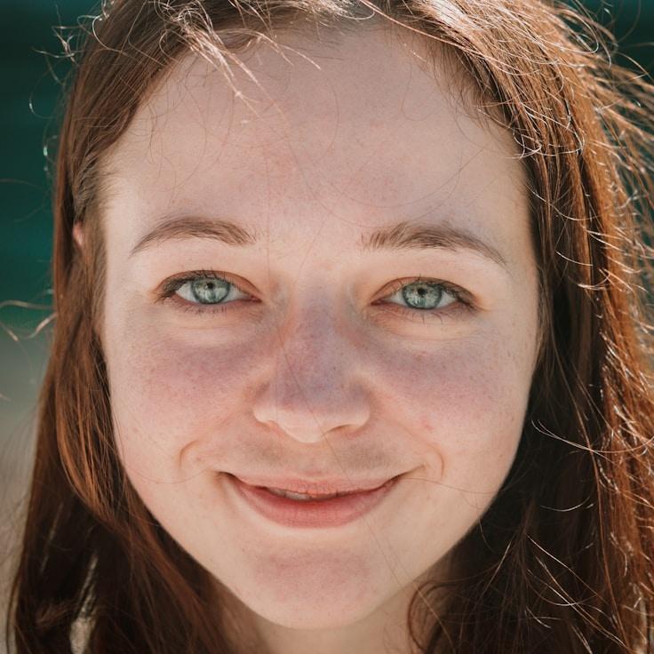 Kaveri Mehta, Lead Design Curator at RidgeHarborGarden, reviewing corporate floral arrangements